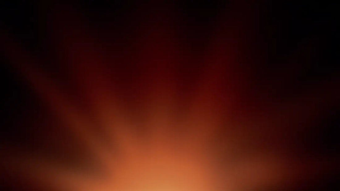 Warm red and orange light glowing through a dark haze