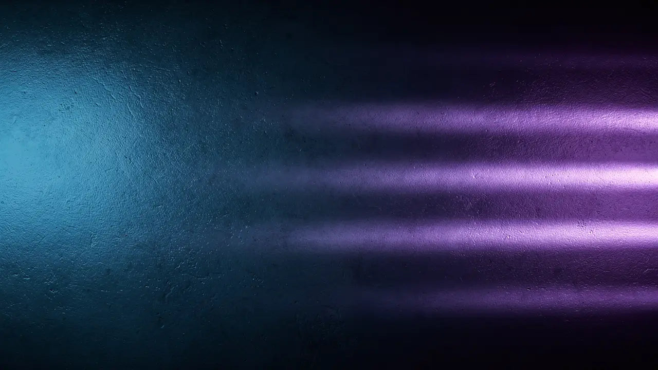 Cool blue and violet light beams across a dark textured wall