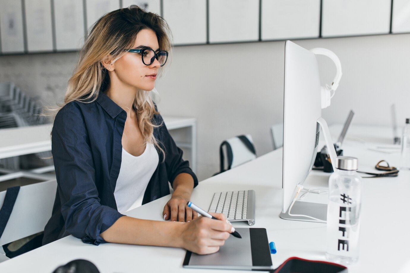 tanned woman in office